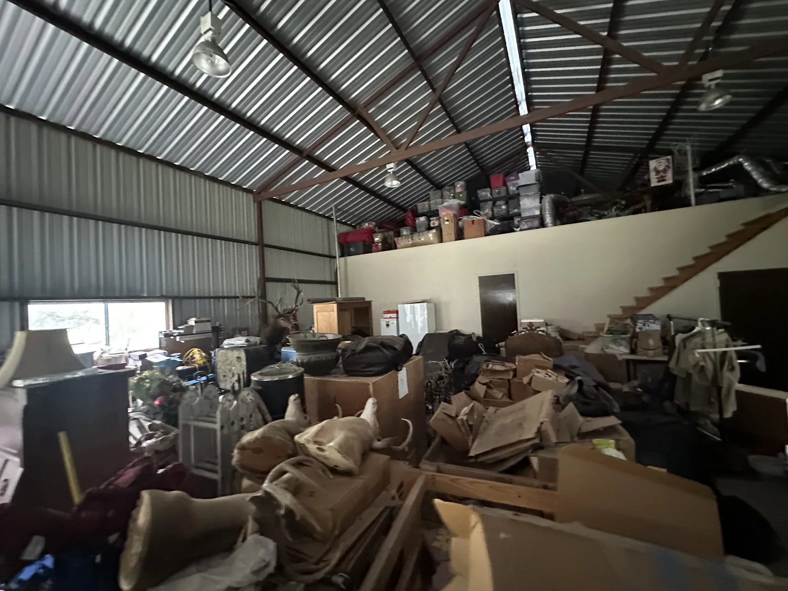 40-foot barn near Driftwood Texas filled floor to ceiling with 20 years of accumulated items before cleanout