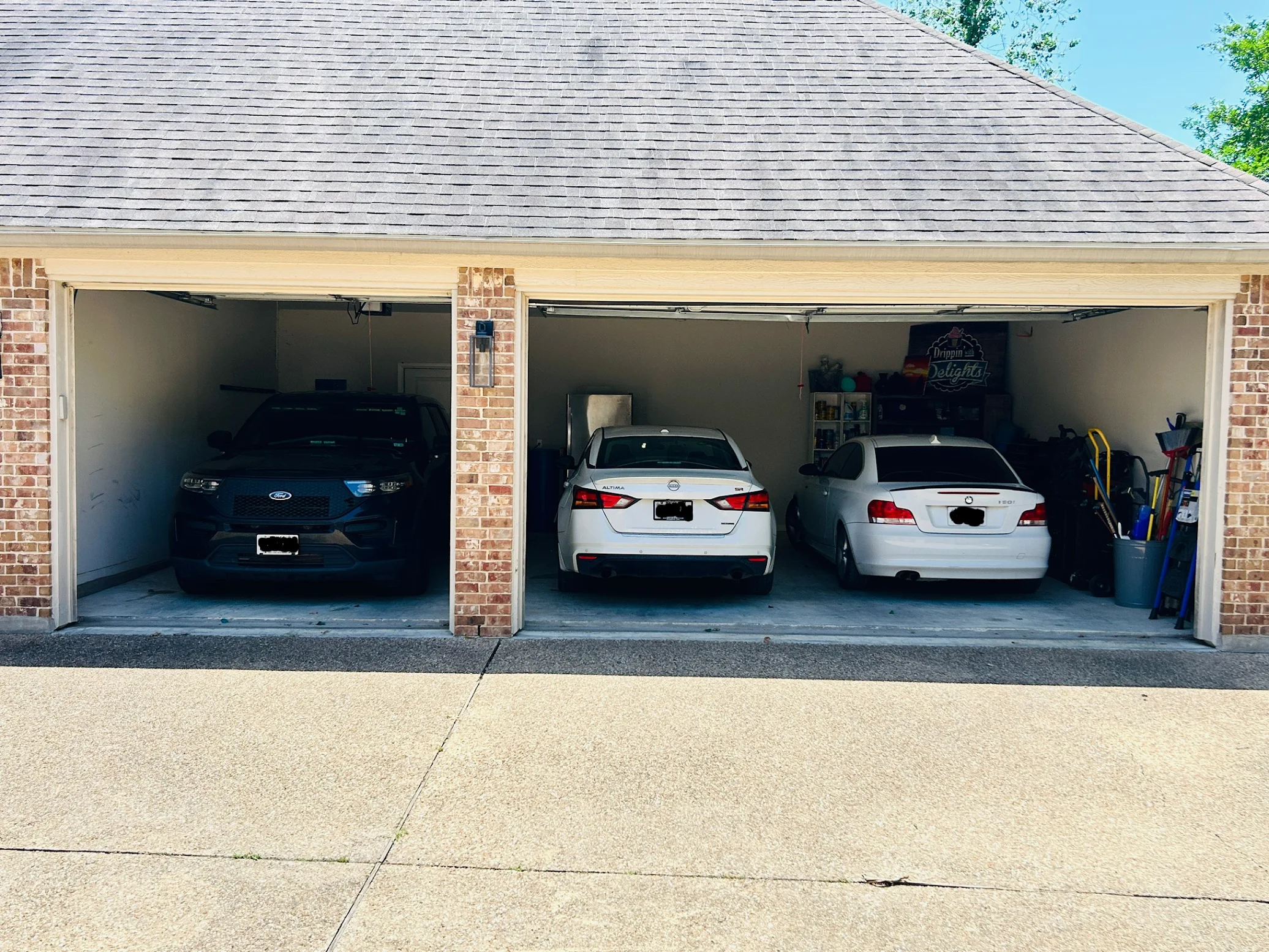 Three cars parked in a clean garage after professional cleanout